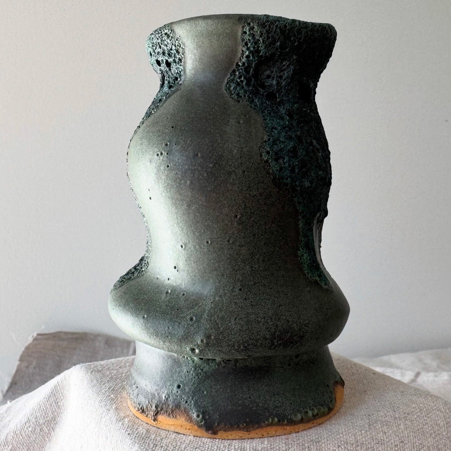 Abstract ceramic sculpture on a neutral background