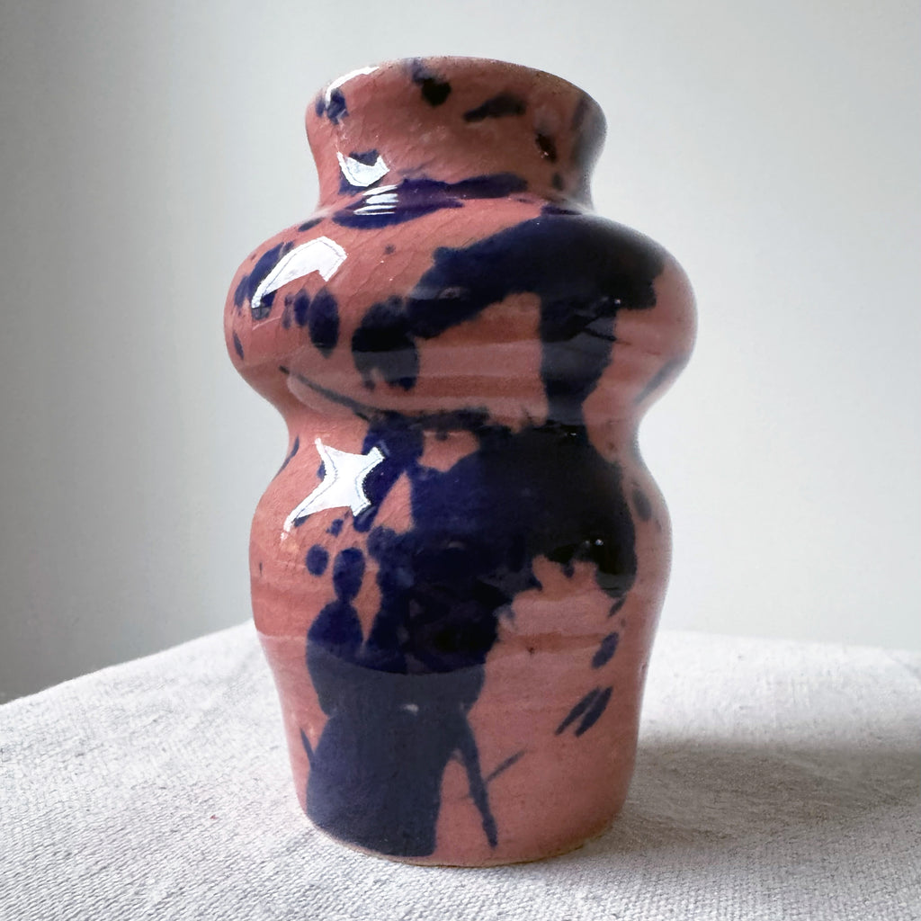 ceramic vase with pink glaze and blue splashes