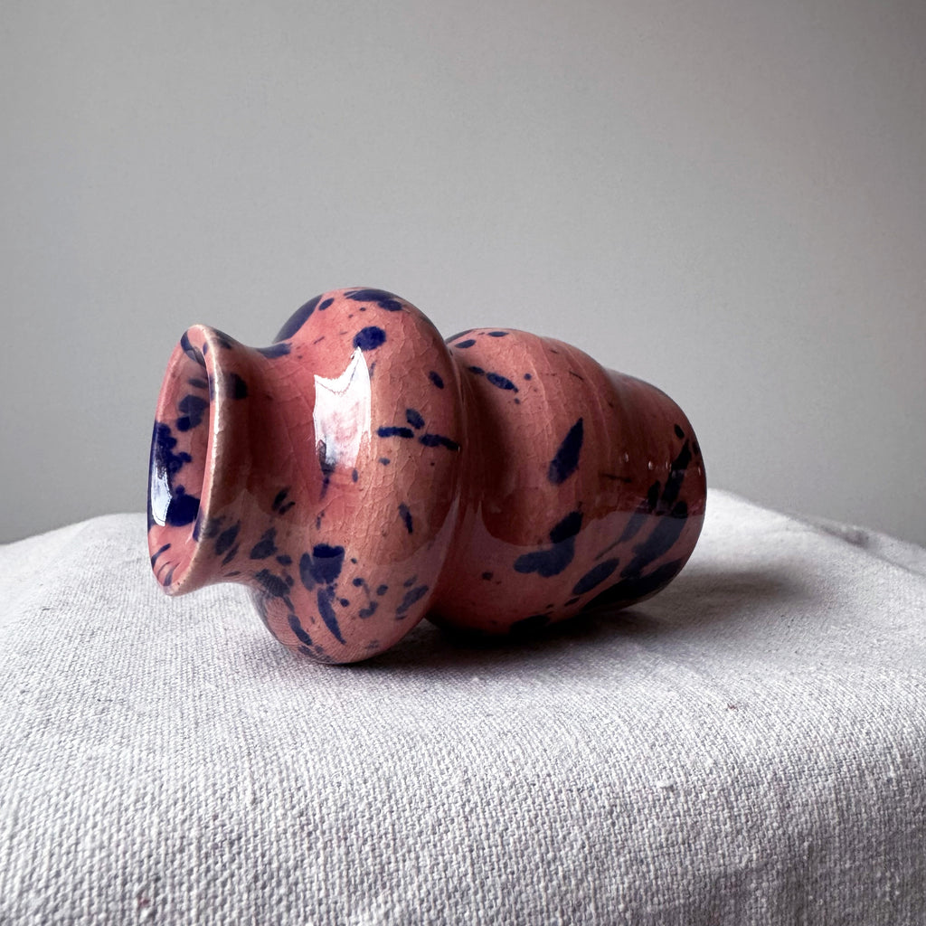 ceramic vase with pink glaze and blue splashes
